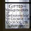 Interior. Basement, W classroom, detail of stained glass commemorative panel