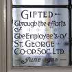 Interior. Basement, W classroom, detail of stained glass commemorative panel