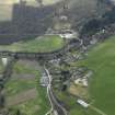 General oblique aerial view centred on the village with Strone House adjacent, taken from the N.