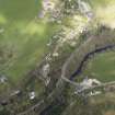 Oblique aerial view centred on the bridge with the village adjacent, taken from the SW.