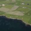 Oblique aerial view centred on the remains of the Holm coastal battery, taken from the SSW.