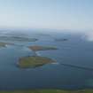 General oblique aerial view of Churchill Barriers Nos.1 (HY40SE 25), 2 (ND49NE 15) , and 3 (ND49NE 16) , Lamb Holm, and Glimps Holm with Scapa Flow and Hunda beyond, Orkney.