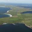 General oblique aerial view of the S end of Westray with Papa Westray to the NE, taken from the SE.