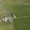Oblique aerial view centred on the ruins of Noltland Castle with Noltland farmsteading adjacent, taken fromt he WNW.