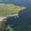 General oblique aerial view of the NE of Westray centred on Pierowall harbour, taken from the SW.