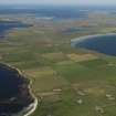 General oblique aerial view towards the SE of Westray across the Bay of Torquoy, taken from the NW.