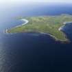 General oblique aerial view of the S end of North Ronaldsay, taken from the SSE.