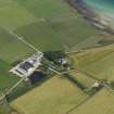 Oblque aerial view centred on Swanbister House with Hillock of Breakna broch adjacent, taken from the WNW.