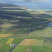 General oblique aerial view of the Loch of Stenness with Maes Howe in the foreground and Hoy in the distance, taken from the NE.