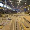Interior. W Fabrication shed, Bay 2. Messer plasma plate cutting machine and plate store.