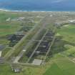 Oblique aerial view of Machrihanish Airfield, taken from the ENE.