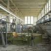 Interior.  View of first floor with beaters and hoppers  in the pulping and blending house.