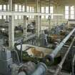 Interior.  General view of first floor with row of beaters taken from raised inspection walkway  in the pulping and blending house.