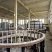 Interior.  View across main hall to a potcher cradle and blaneders in the pulping and blending house..