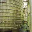 Interior.  Detail of wooden solvent storage tanks in solvent storage and handling building.