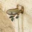 Interior.  Detail of drinking fountain in side door access corridor in charge vat house.