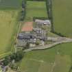 Oblique aerial view centred on the school/community centre with the primary school adjacent, taken from the W.