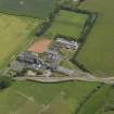 Oblique aerial view centred on the school/community centre with the primary school adjacent, taken from the WSW.