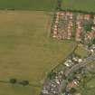 Oblique aerial view of the cropmarks of the settlements, taken from the SE.