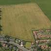 Oblique aerial view of the cropmarks of the settlements, taken from the ENE.