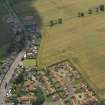 Oblique aerial view of the cropmarks of the settlements, taken from the NNW.