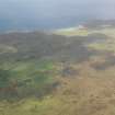 General oblique aerial view (distant) centred on the airfield, taken from the SE.