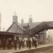 View of group of station workers, likely at Stanley Junction Station, Perthshire.