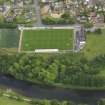 Oblique aerial view of Annan Athletic Football Club, taken from the NW.