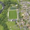 Oblique aerial view of Annan Athletic Football Club, taken from the SSW.