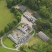 Oblique aerial view of Kinmount House stables, taken from the NNE.