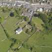 Oblique aerial view of Whithorn Parish Church and priory, taken from the W.