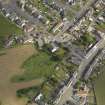 General oblique aerial view of Whithorn centred on St John's Church and Mansefield, taken from the NW.