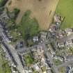 General oblique aerial view of Whithorn centred on St John's Church and Mansefield, taken from the SSW.