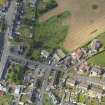 General oblique aerial view of Whithorn centred on St John's Church and Mansefield, taken from the SSE.