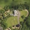 Oblique aerial view of Caprington Castle and stables, taken from the SSW.