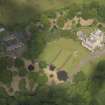 Oblique aerial view of Caprington Castle and stables, taken from the SSE.