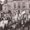 View of Abbey Place, Jedburgh with people gathered forcomunity picnic 
Titled: 'Jedburgh Picnic. 1886. A.R.E.'

