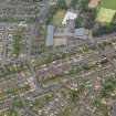 Oblique aerial view centred on the schools with the community centre adjacent, taken from the ENE.