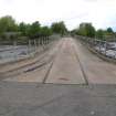 General view. Motray Bridge looking north east, showing two gauges of railway track.