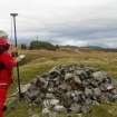 General view of Mr Ian Parker (RCAHMS) using differential GPS to survey a small cairn overlying the inner wall of the timber-laced fort.