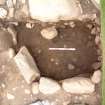 Trench 15, feature F15.05 from SW (above) after section excavation showing floor context C15.24 (scale = 0.5m)
