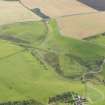 Oblique aerial view centred on the railway bridge with the remains of the railway adjacent, taken from the NW.