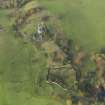 Oblique aerial view centred on the remains of the country house, taken from the ESE.