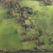 Oblique aerial view centred on the remains of the country house, taken from the W.