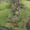 Oblique aerial view centred on the remains of the country house, taken from the WSW.