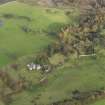 Oblique aerial view centred on the remains of the country house, taken from the SW.