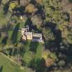 Oblique aerial view centred on the tower house/country house, taken from the S.