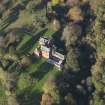 Oblique aerial view centred on the tower house/country house, taken from the SE.