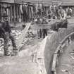 View of workers during the construction of Granton Gas Works, Edinburgh. 
Titled: 'Brickwork at Bottom of tank on North side. 1st November 1899'.