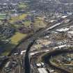 General oblique aerial view of Glasgow showing the route of the M74 extension going through the Rutherglen to Polamadie area centred on Power Motive Works, taken from the E.